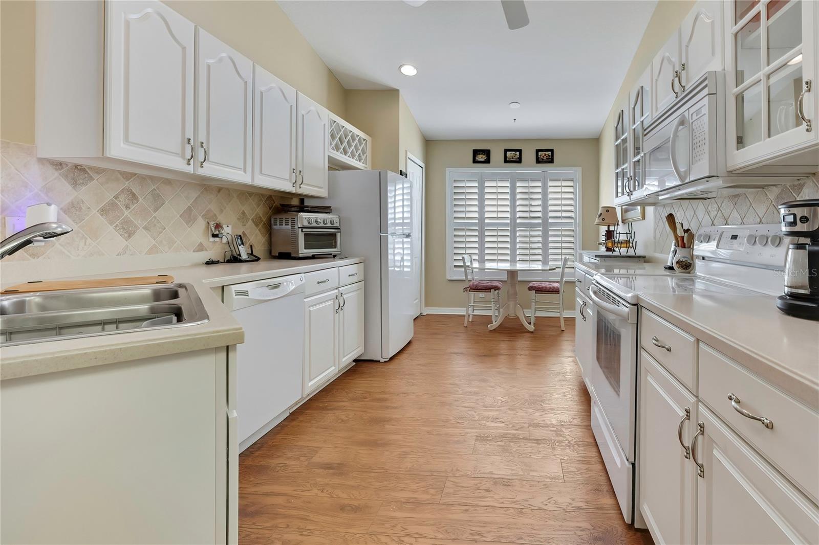 Wood and Glass Cabinets, Corian Counters