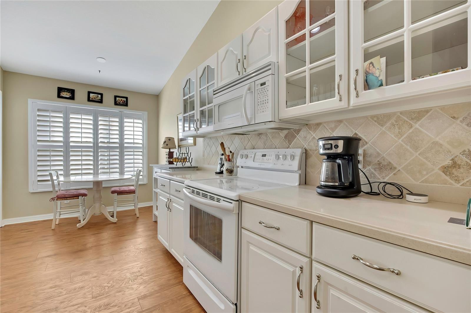 Wood and Glass Cabinets, Corian Counters