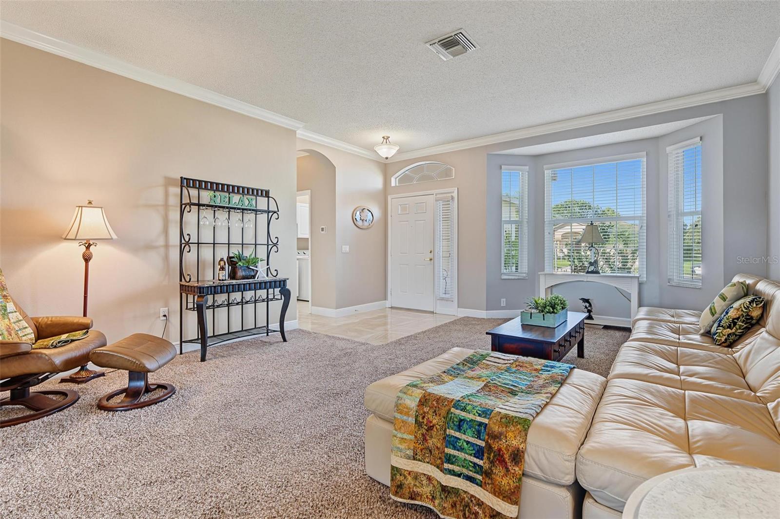 Separate living room off foyer with bay window