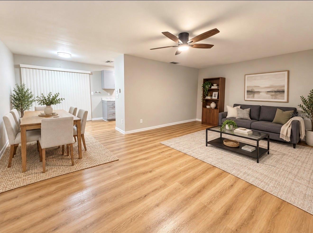 Virtually Staged View of Living Room and Dining Room