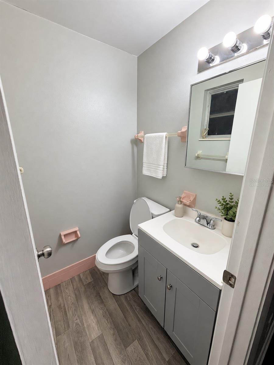 Virtually Staged Half Bathroom located in Primary Bedroom