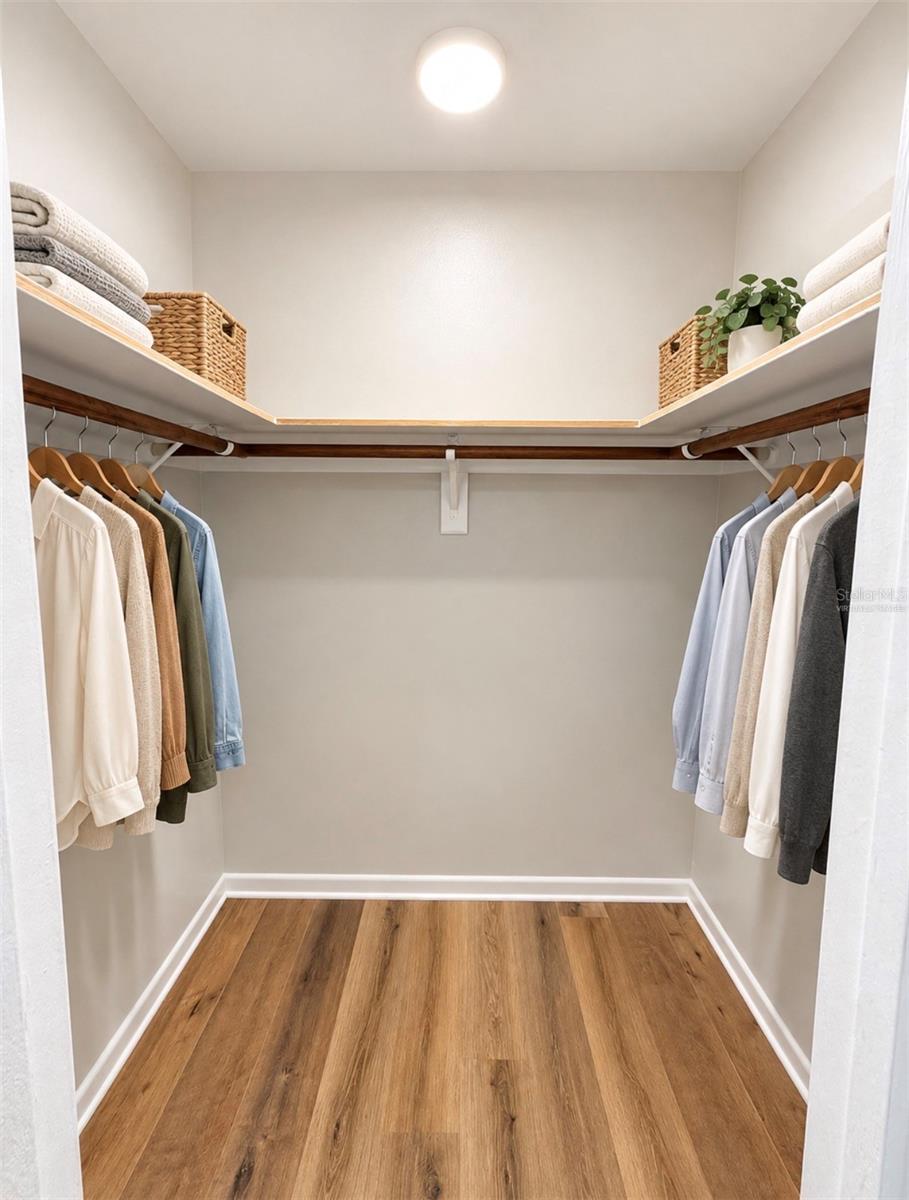 Virtually Staged Primary Bathroom Walk-In Closet