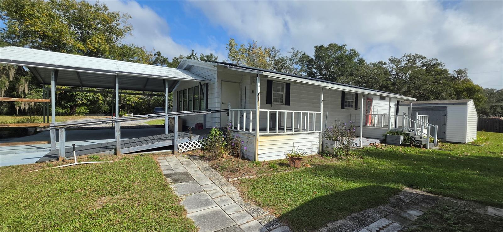 Back of home and 2 porches