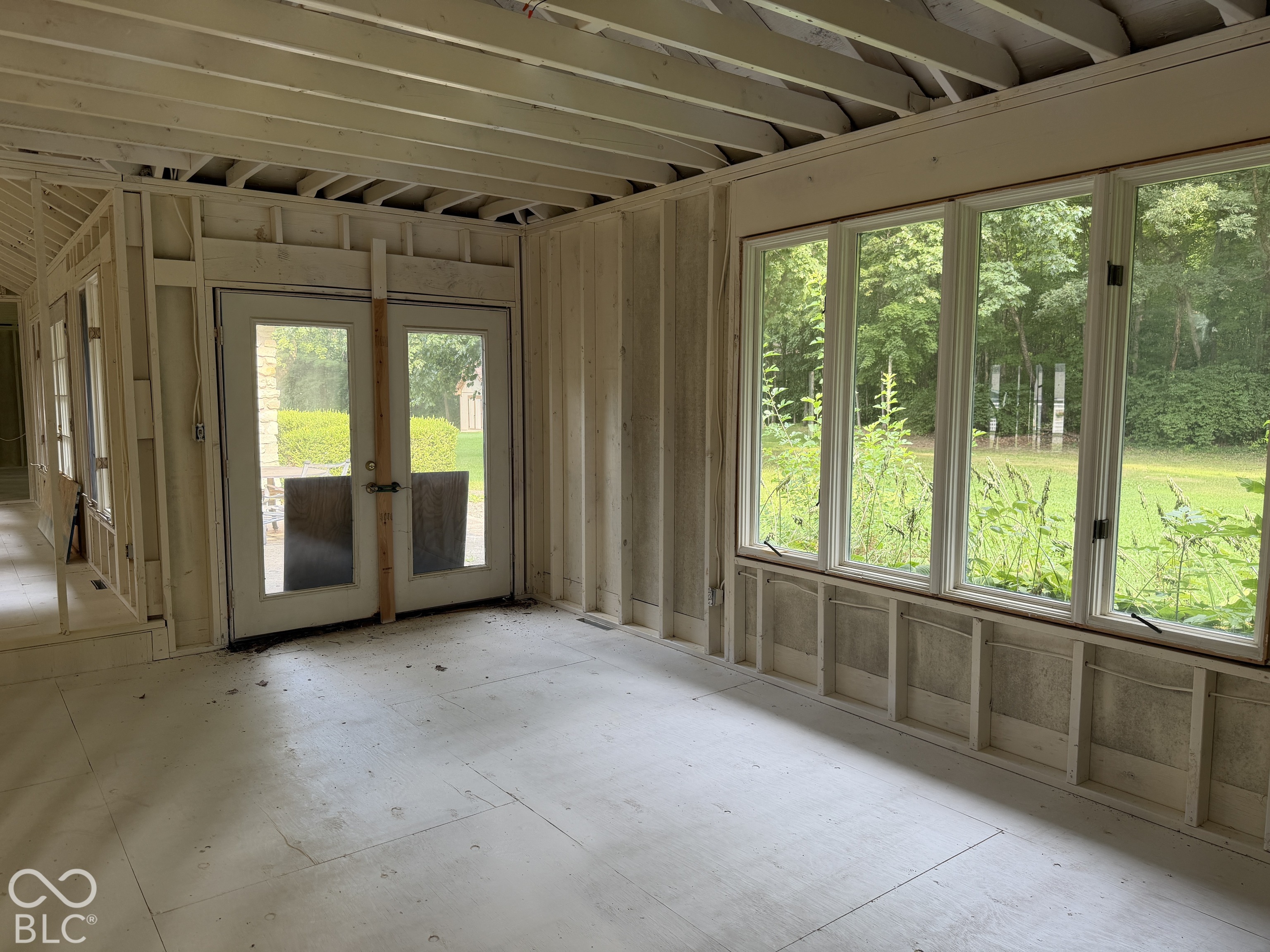 Large Window and French door overlooking picturesque back yard