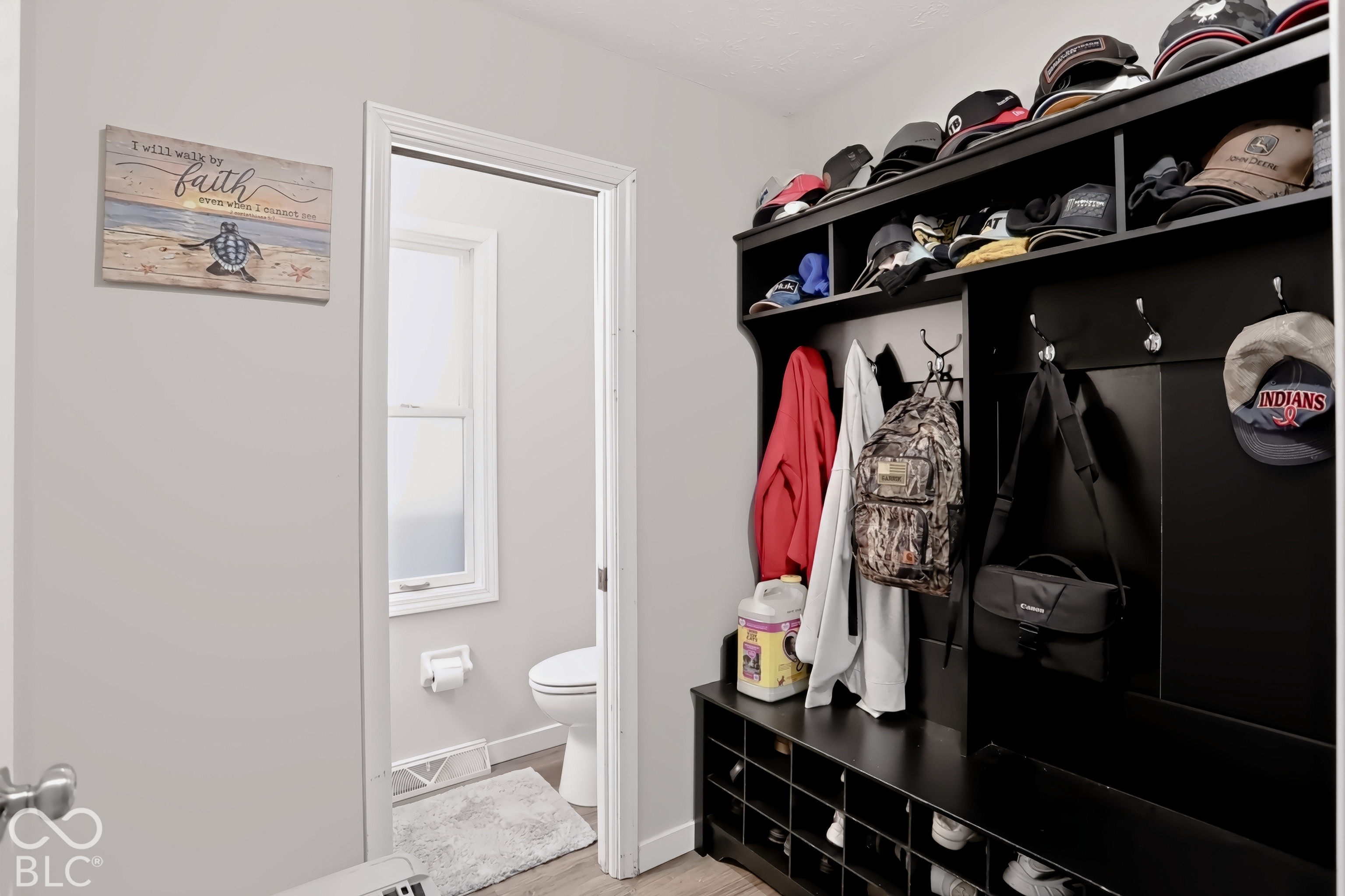 Built-in mudroom storage with multiple compartments and integrated hooks