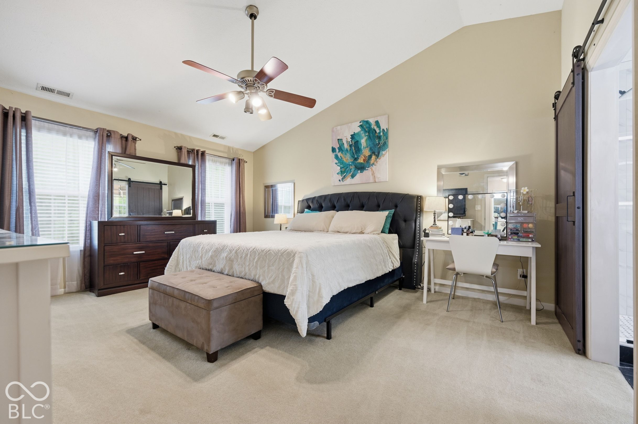 Large Primary Bedroom Features A Vaulted Ceiling