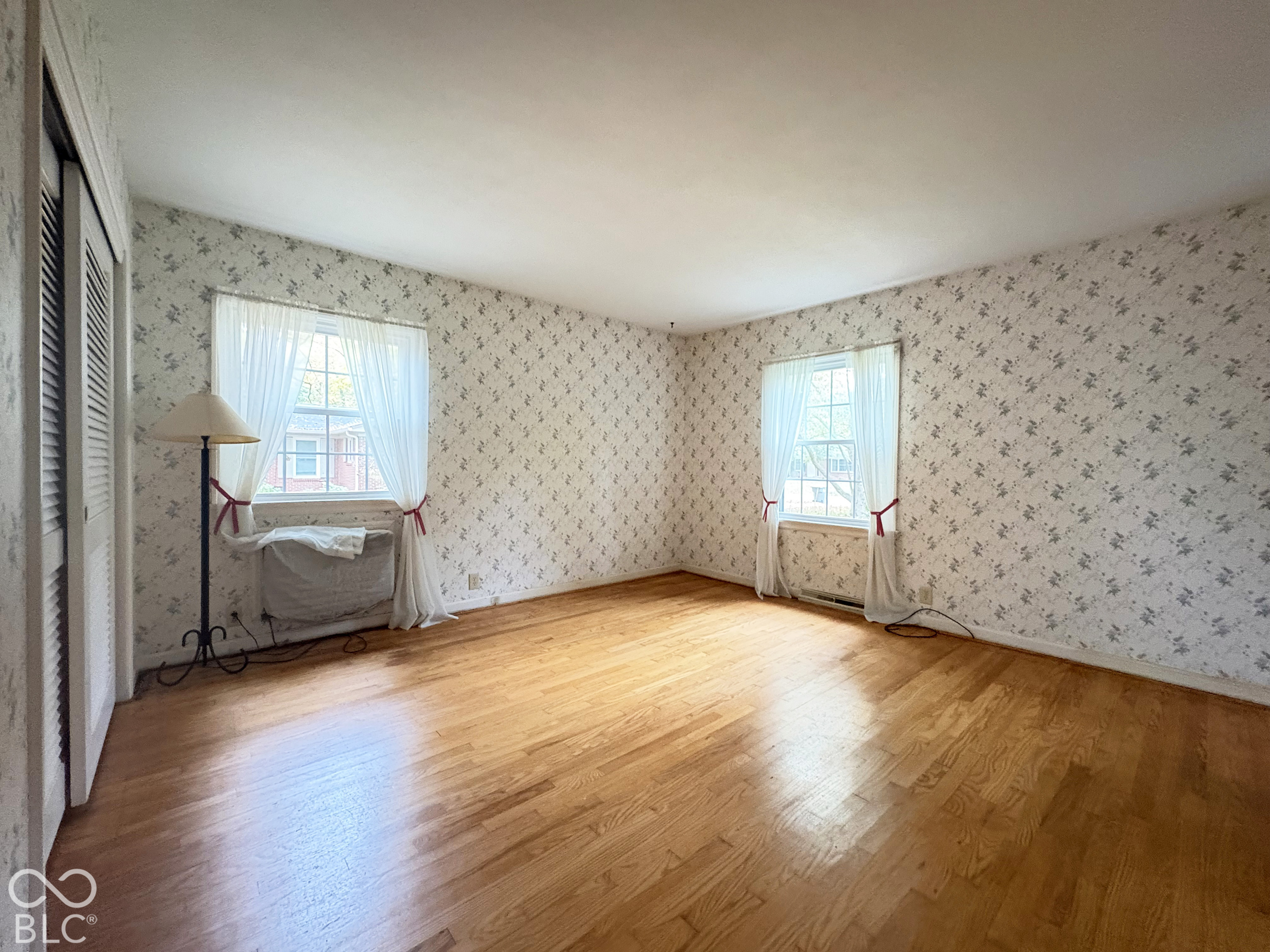 Primary bedroom, 14' x 13' 6", has private full bath and two closets.