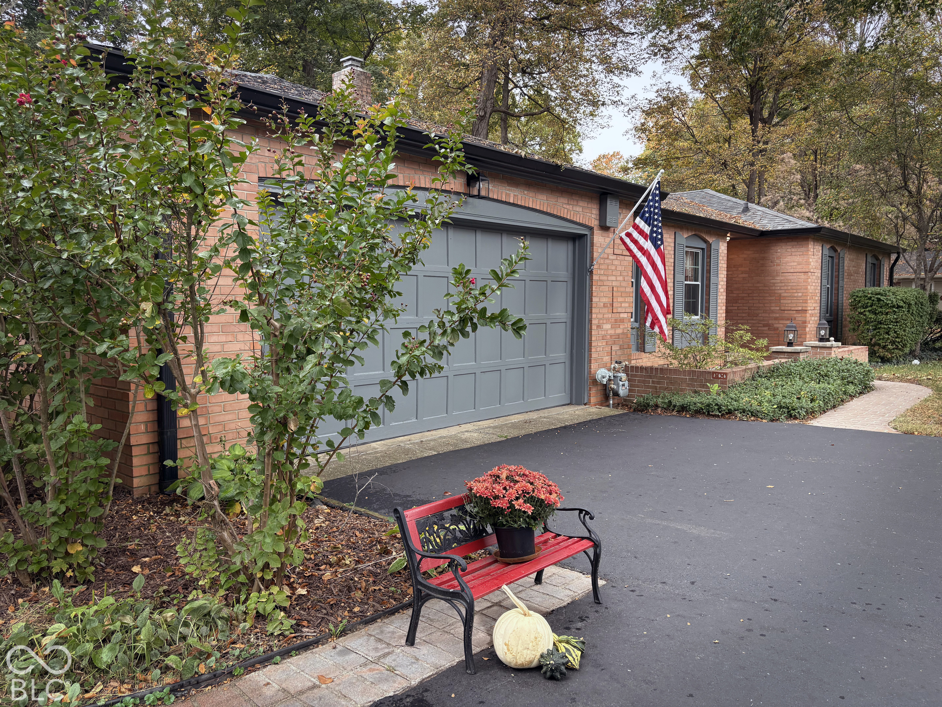 2 car attached garage with exterior door to side yard, and door leading to laundry room and kitchen.