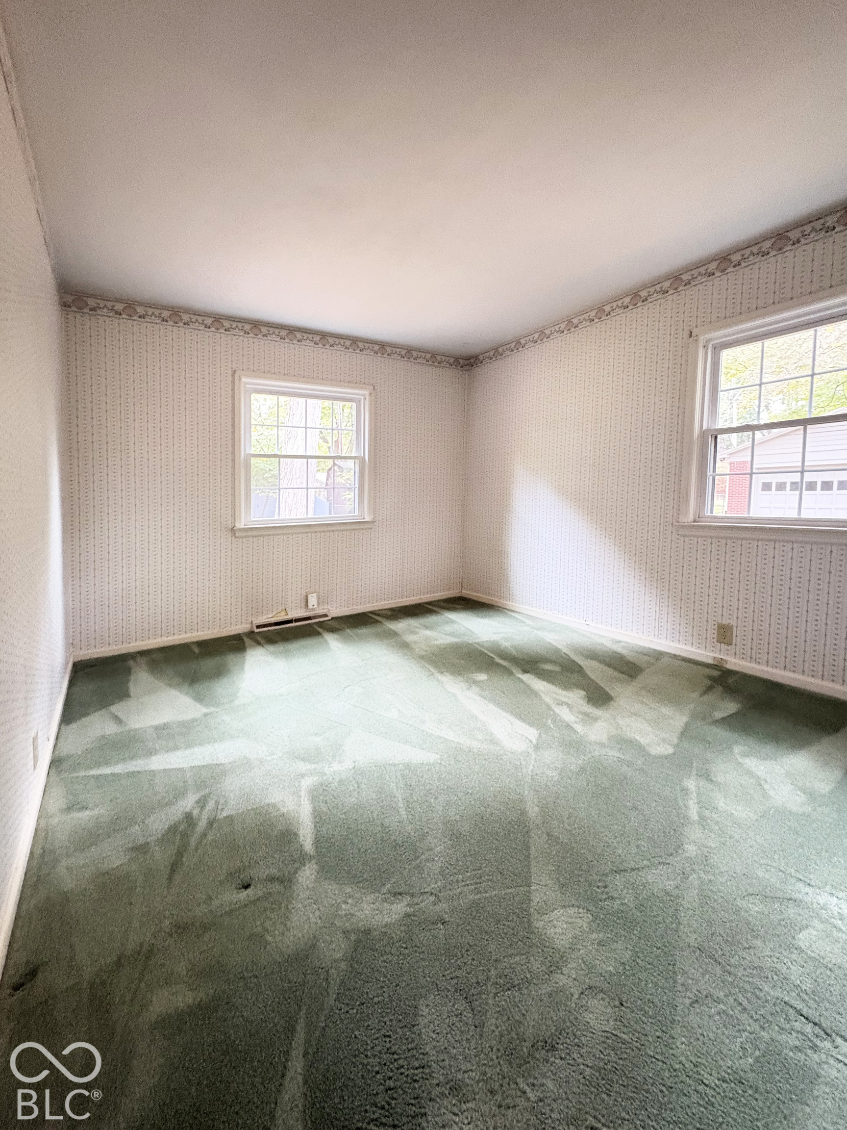 2nd bedroom. There is hardwood floor under this carpet.