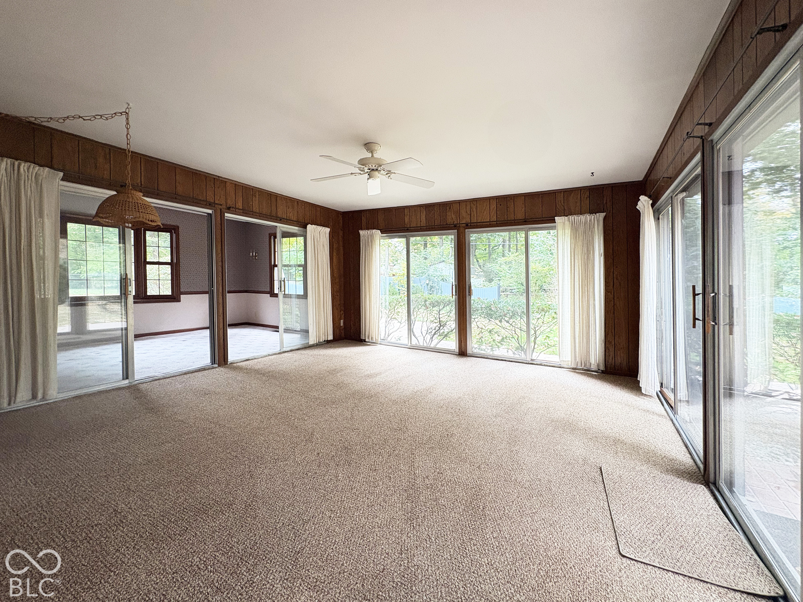 What sets this home apart from many midcentury ranches is a large two-room addition with 432 sf of flexible living space that could be used as dining room, office, playroom, workout space.