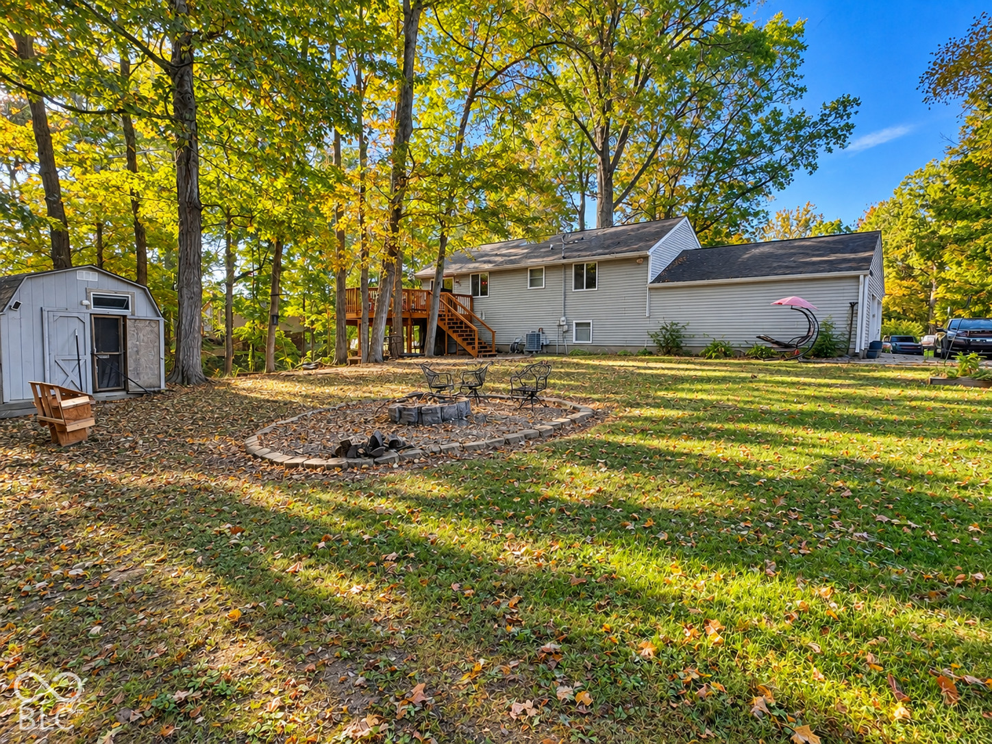 Yard features plenty of room for play and entertaining plus mini barn and large outbuilding for extra storage