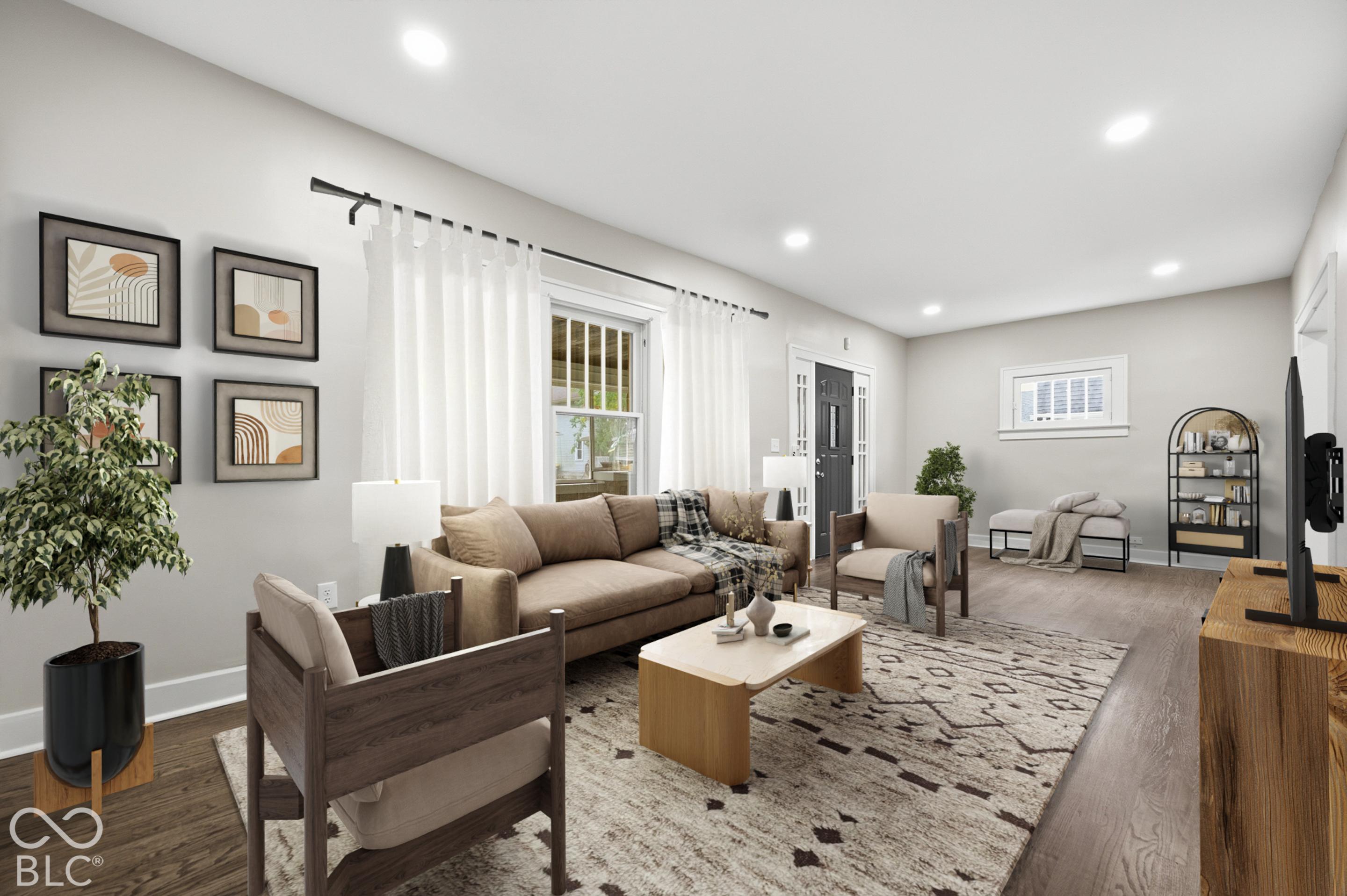 Neutral interior featuring wood-finish flooring, recessed lighting, and a multi-pane window with traditional casing