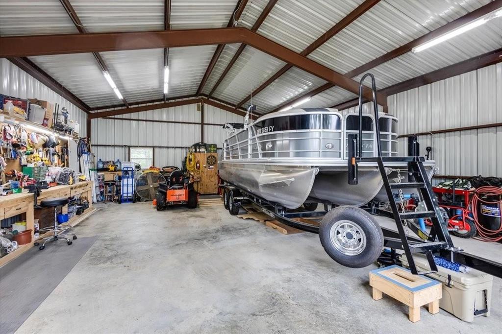 Garage with a workshop area and metal wall