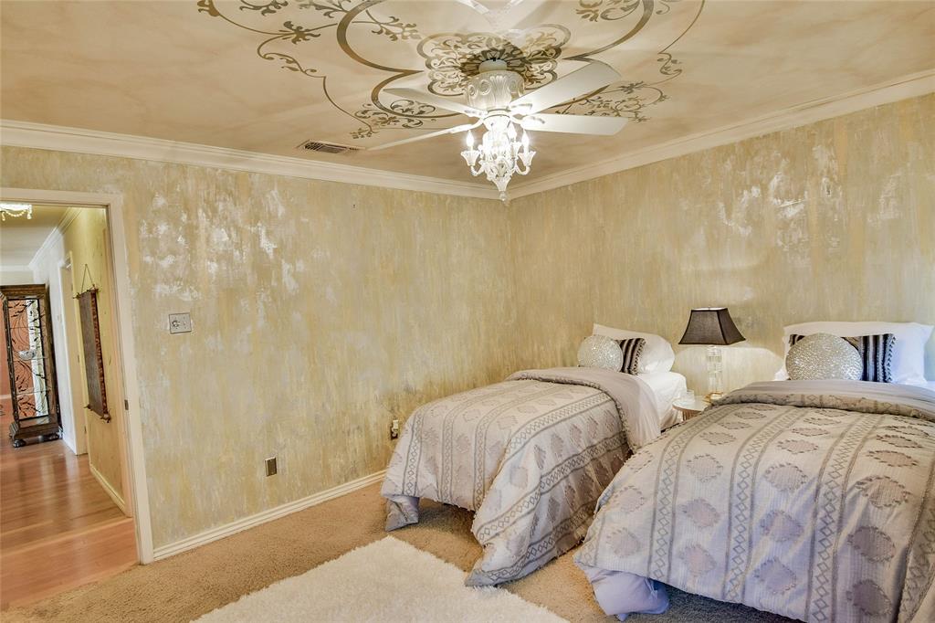 Bedroom with baseboards, crown molding, and ceiling fan