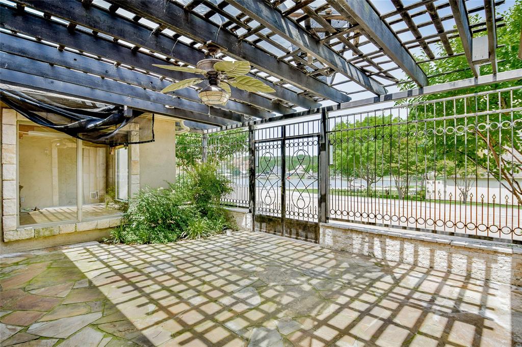 View of patio with a ceiling fan and a pergola