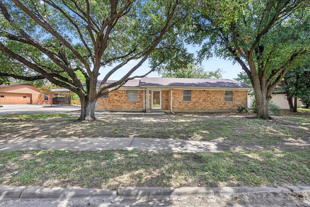 Ranch-style home featuring brick siding