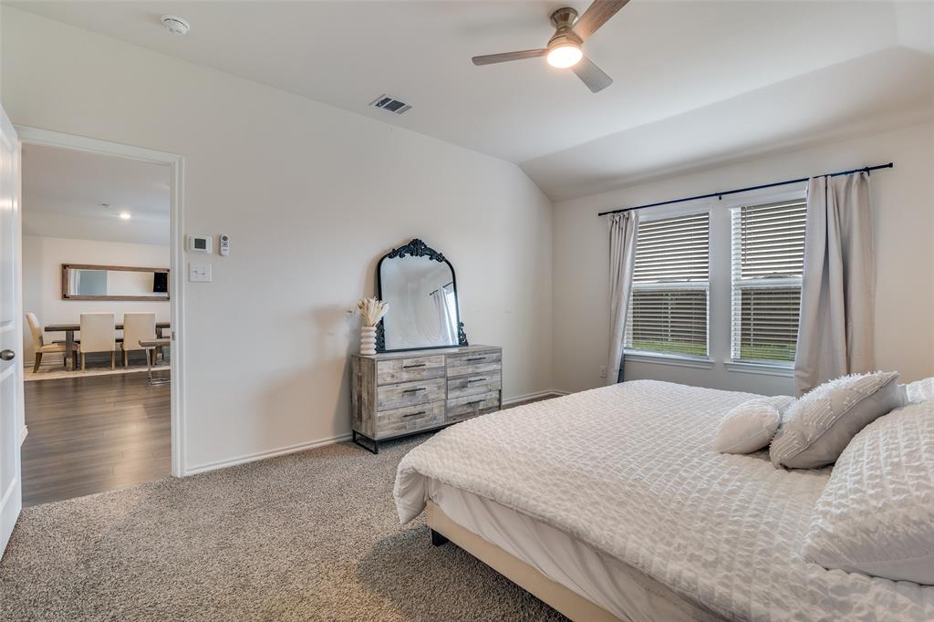 Primary, wonderful windows to back yard.