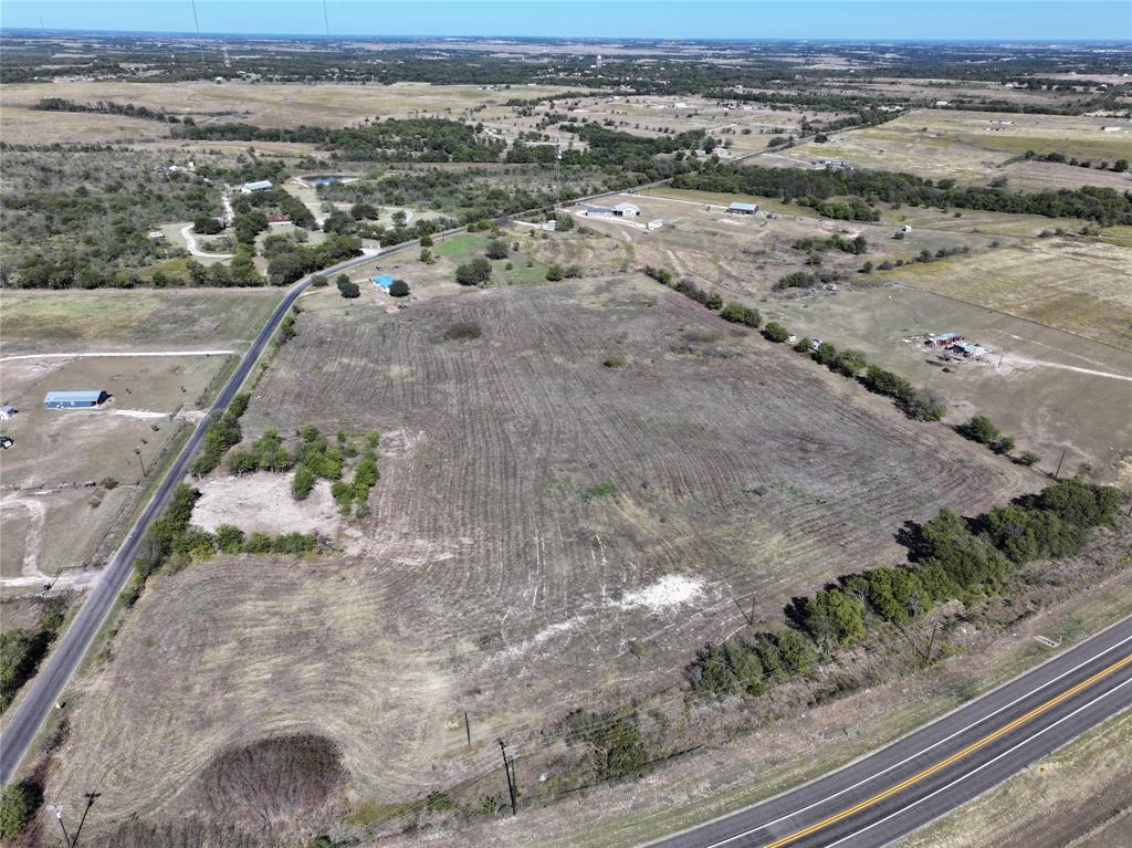 Aerial view of property's location featuring rural landscape and rows of crops