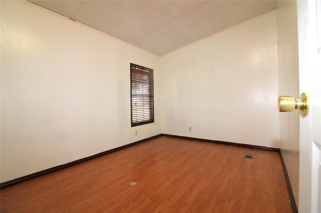 Bedroom #5 OR OFFICESpare room with wood finished floors and baseboards
