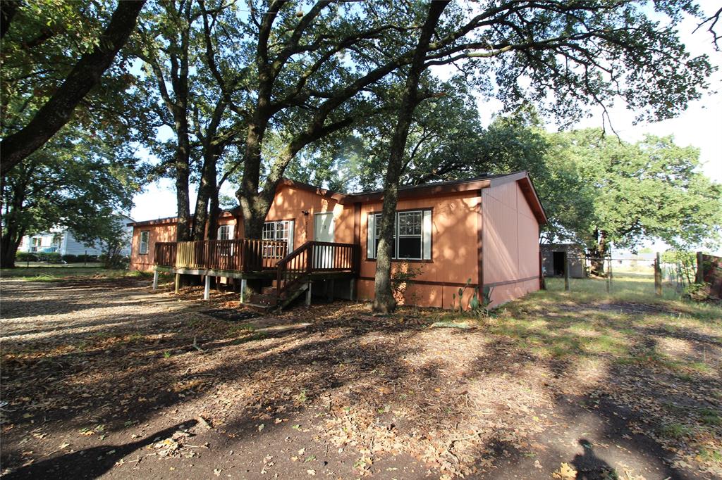 Back of property with a wooden deck Back of property with a wooden deck