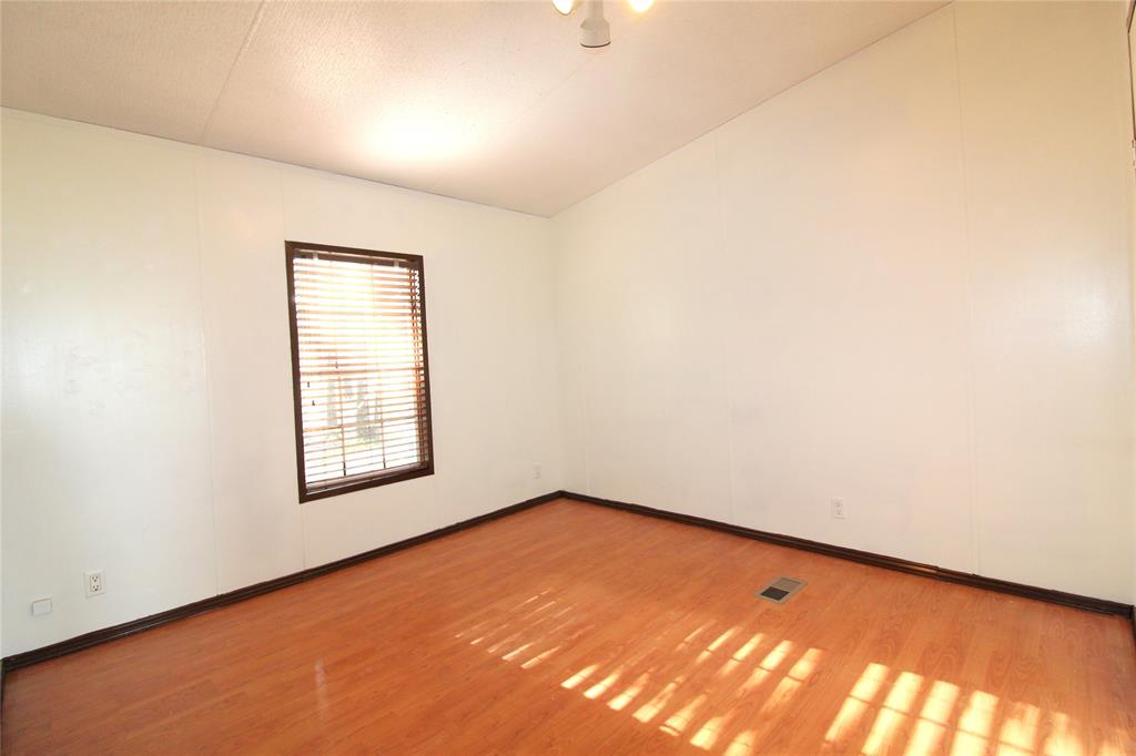 Bedroom #4Spare room featuring light wood-style floors and baseboards