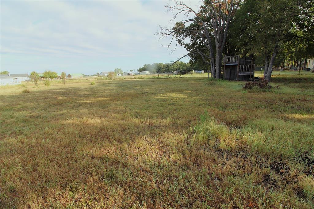 View of yard with a view of countryside and a wooden deck View of yard with a view of countryside and a wooden deck