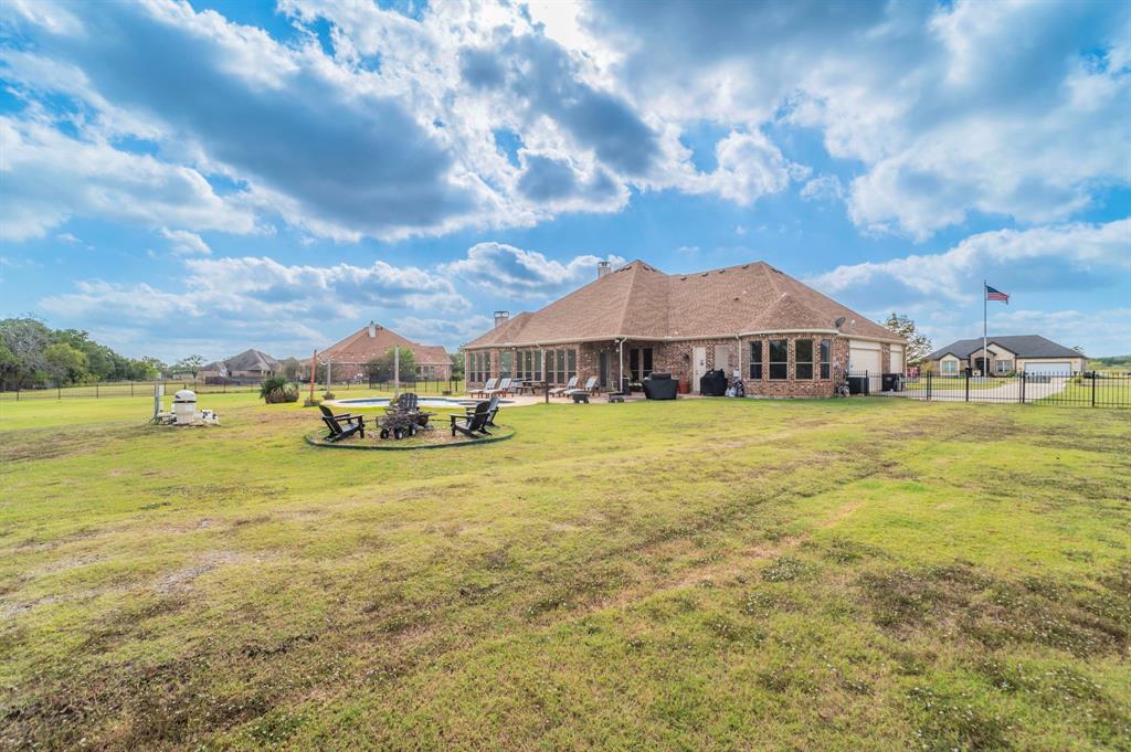 View of yard with a patio area and an outdoor fire pit