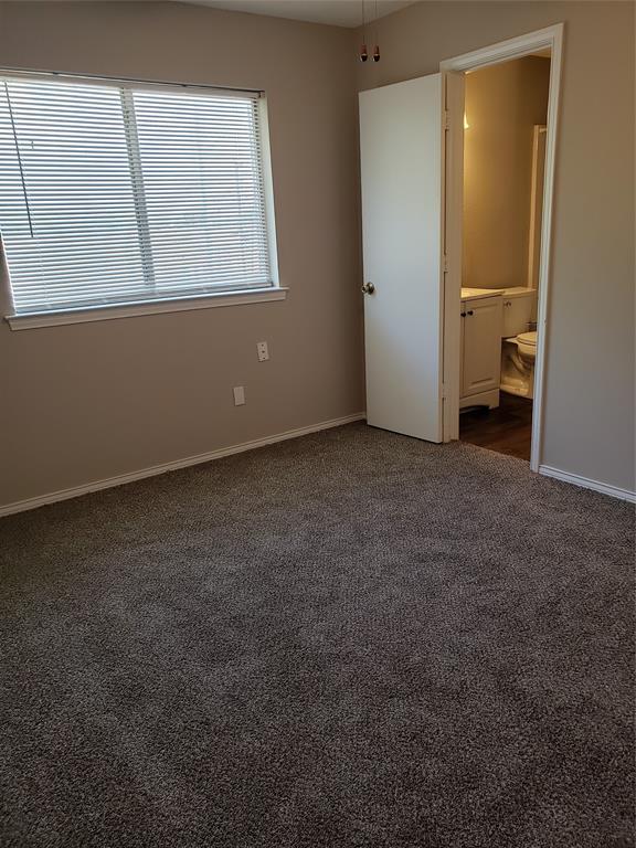 808 - Bedroom with door into shared bathroom.