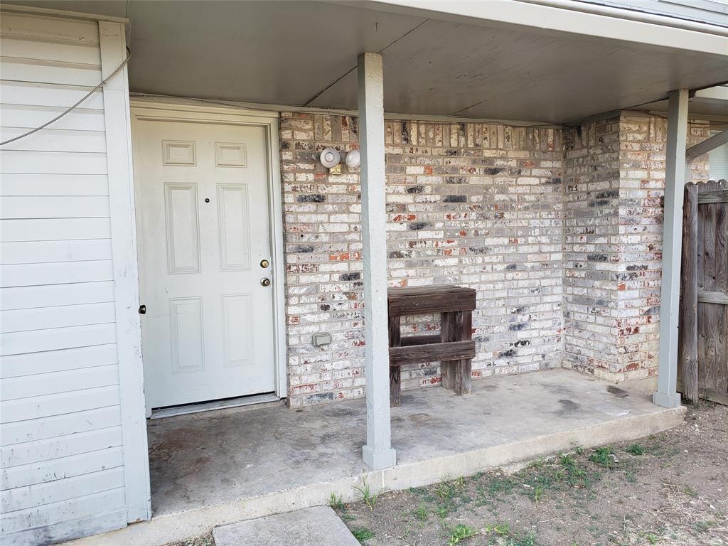 808 - Back covered porch, storage closet to the left. 808 - Back covered porch, storage closet to the left.