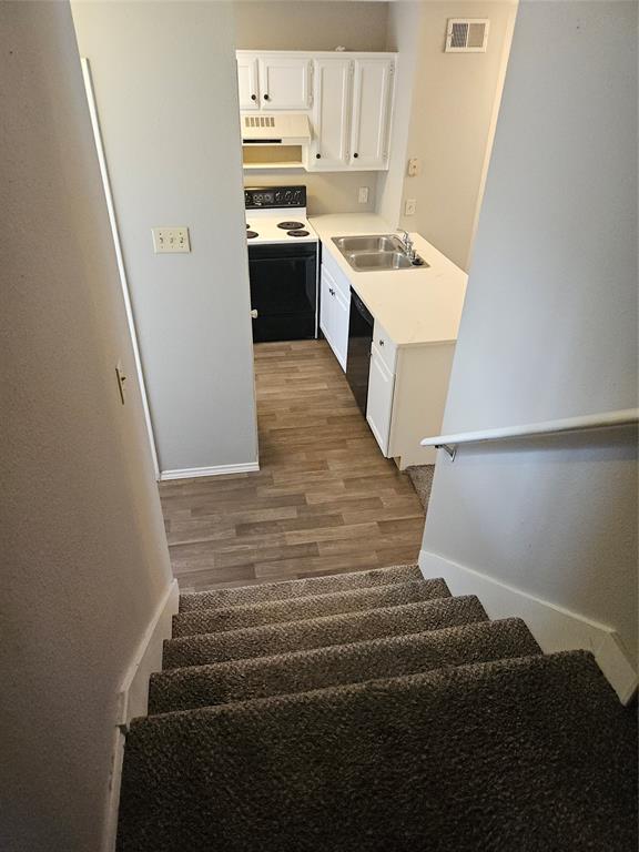 810 - View of kitchen from stair landing.