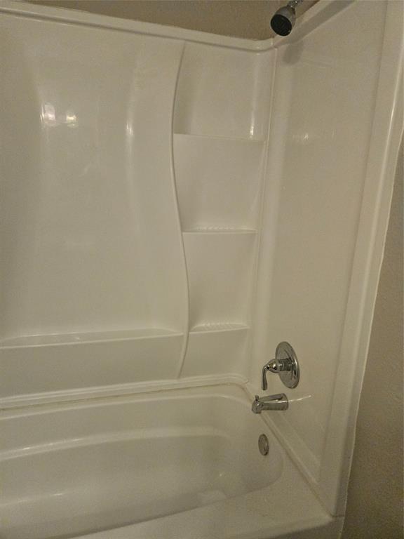 810 - Tub with shower walls.