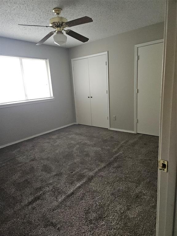 810 - Bedroom with two closets and ceiling fan with light.