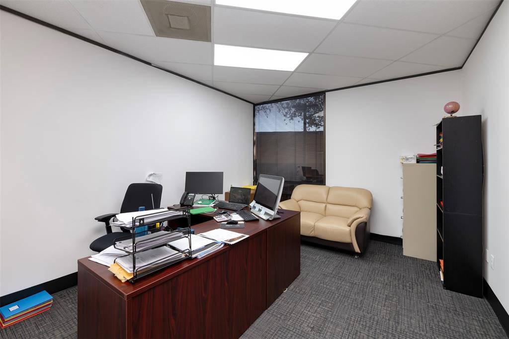 Office space featuring a drop ceiling