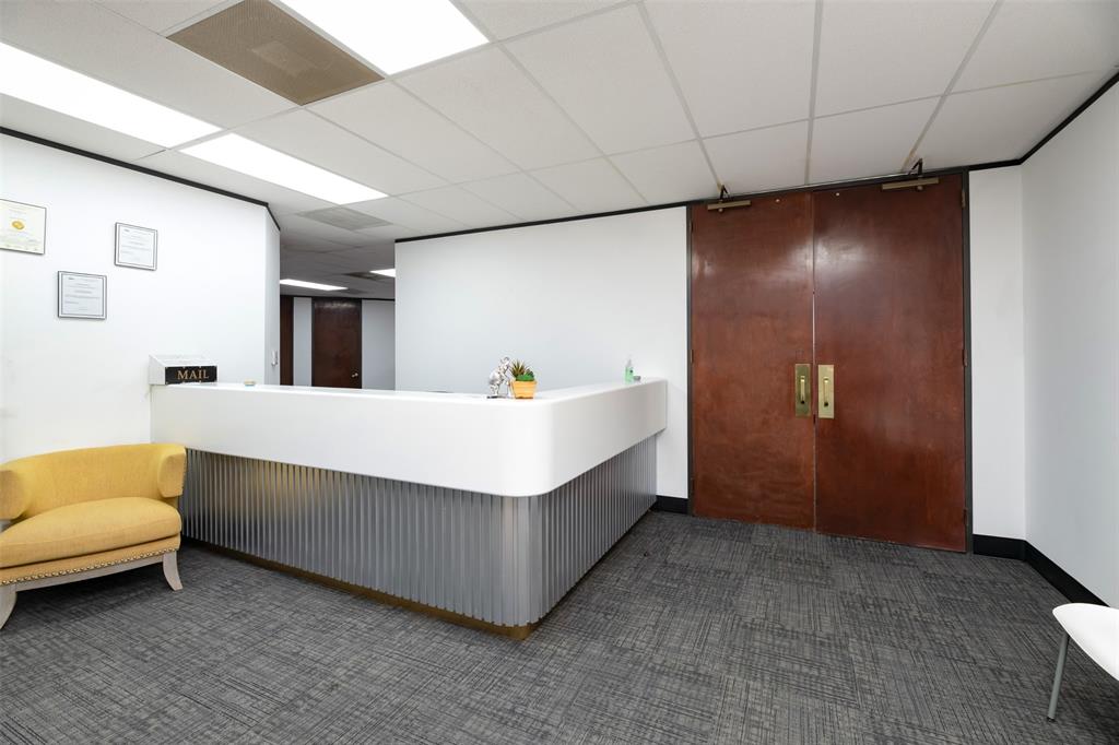 Reception area featuring a drop ceiling Reception area featuring a drop ceiling