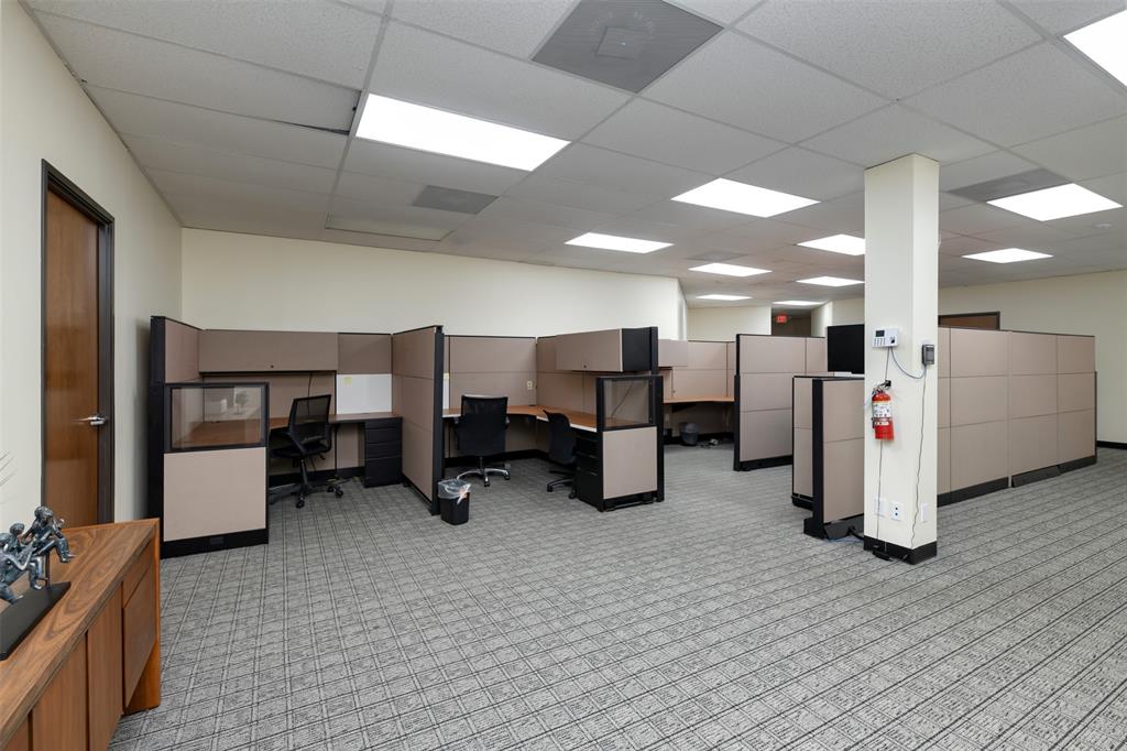 Office space with a paneled ceiling