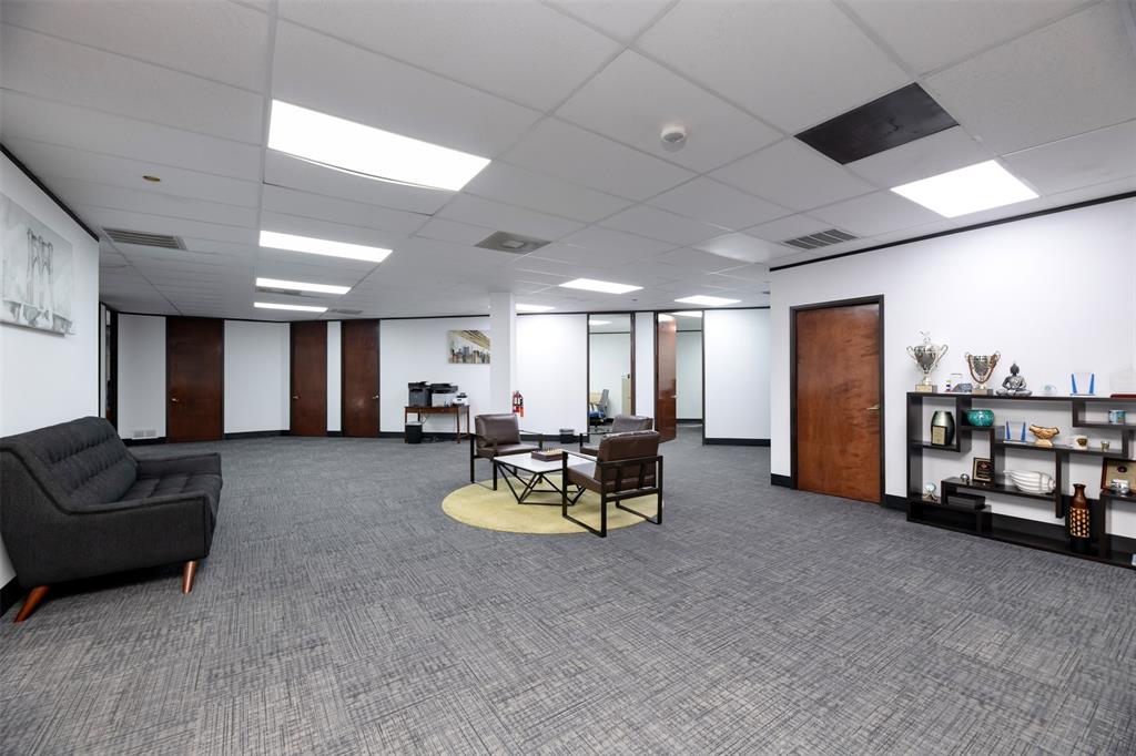 Building lobby featuring a paneled ceiling Building lobby featuring a paneled ceiling
