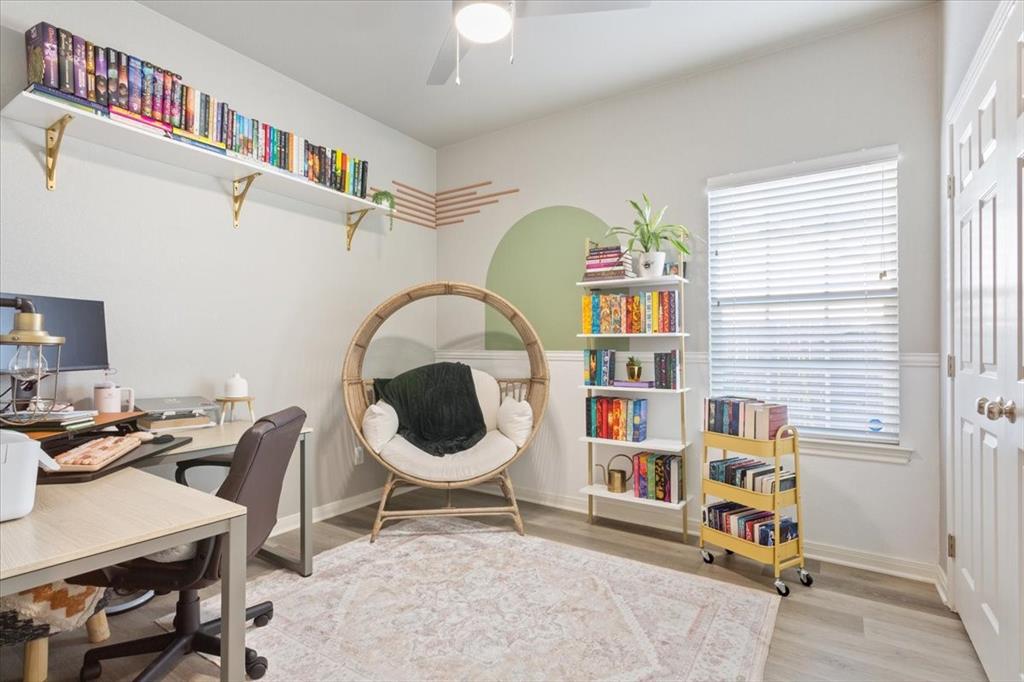 Home office featuring light wood-style floors and ceiling fan
