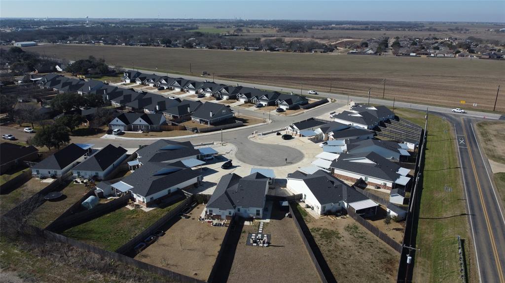 Aerial overview of property's location featuring nearby suburban area