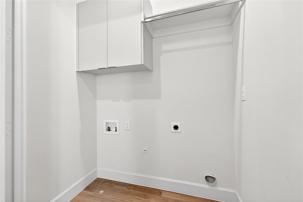 Full size laundry closet with built in cabinetry
