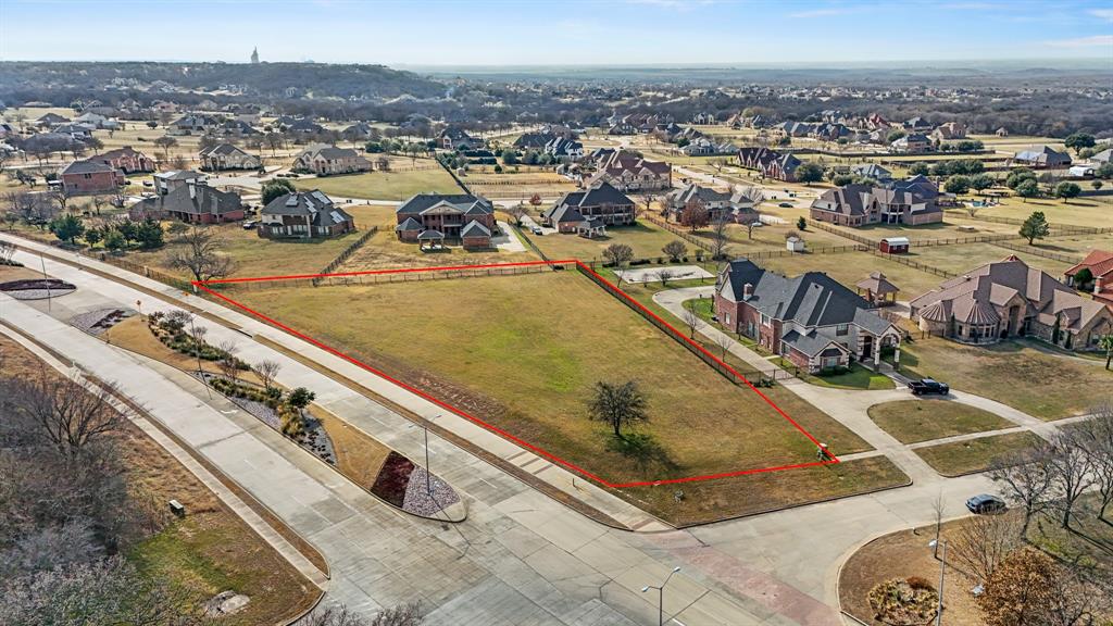 Aerial perspective of suburban area with property parcel outlined