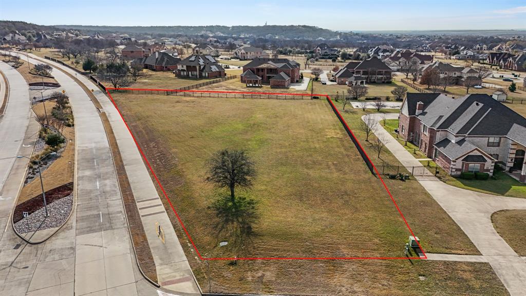 Aerial perspective of suburban area with property parcel outlined