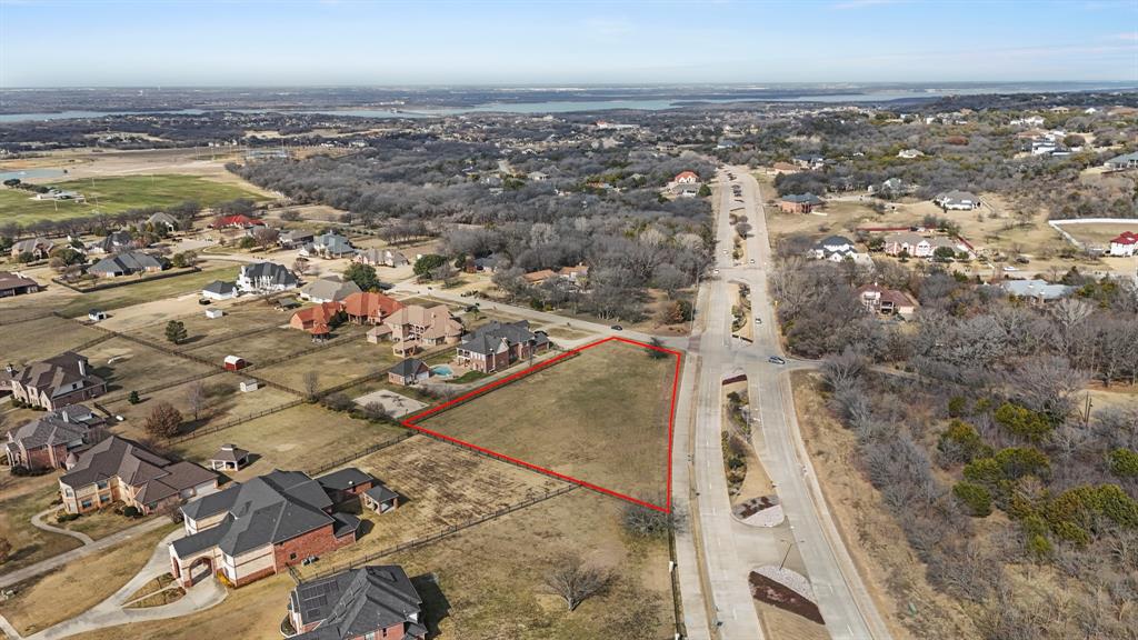 Aerial view of residential area featuring property parcel outlined