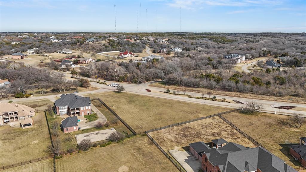 Aerial view of property's location featuring nearby suburban area