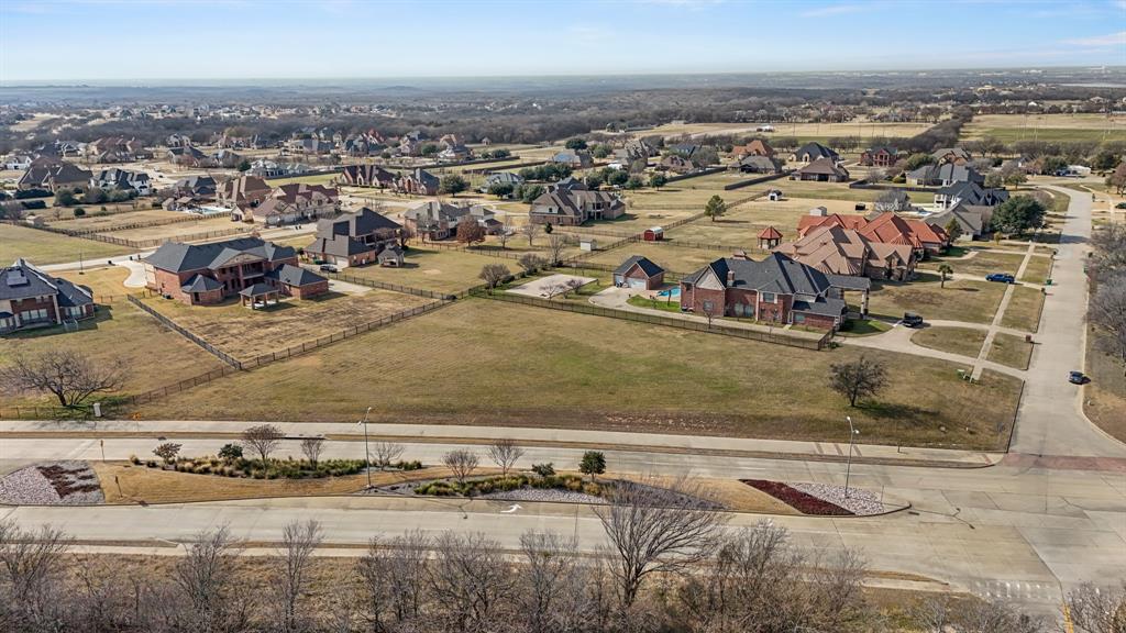 Aerial view of property's location with nearby suburban area