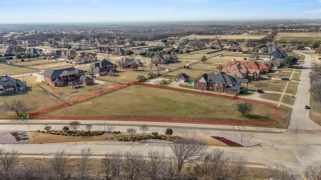 Aerial perspective of suburban area featuring property boundaries highlighted