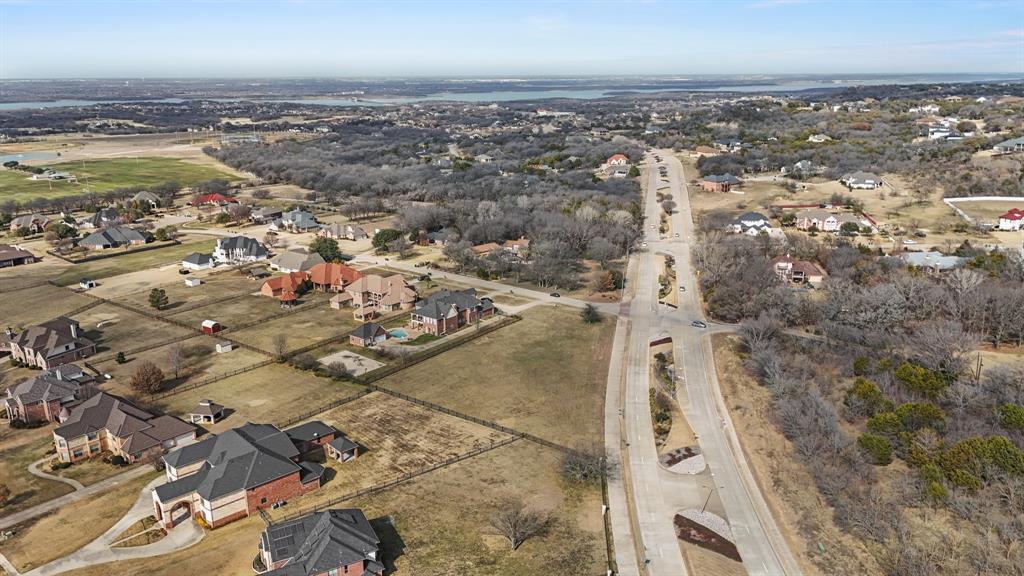 Aerial view of property's location featuring nearby suburban area