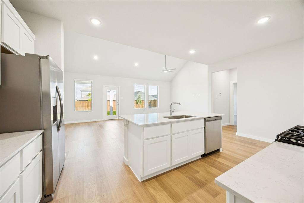 Kitchen in the Masters home plan by Trophy Signature Homes – REPRESENTATIVE PHOTO
