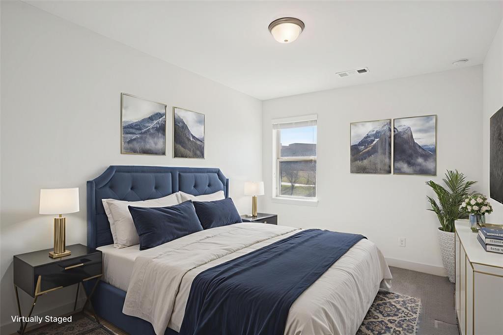 2nd floor bedroom featuring baseboards and light colored carpet