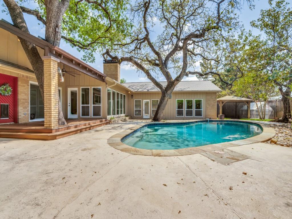 View of swimming pool featuring patio surround and a gazebo