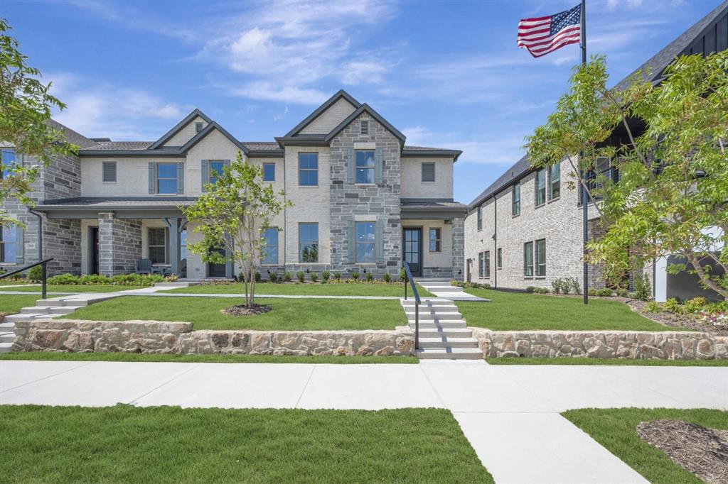 Multi-level facade featuring stone and stucco finishes